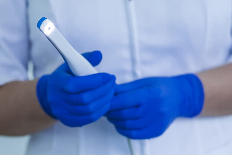 Nurse holding a Intraoral camera